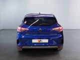 the rear end of a blue car in a white room
