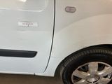 a picture of a white car with a sticker on the door