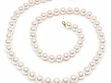 a white pearl necklace and bracelet set on a white background