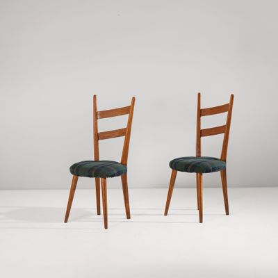 pair of chairs in the style of person