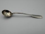 silver spoon on a table with a white background