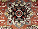 an oriental rug with a red, blue, and yellow design