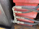 a bunch of hoses that are connected to the back of a truck