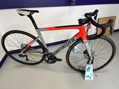 a bike that is sitting on a stand in a room