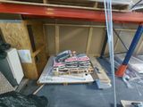 a pile of tools sitting on a pallet in a warehouse