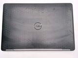 dell laptop computer sitting on top of a table with a white background