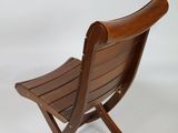 a wooden chair that is sitting on a white background