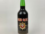 a bottle of alcohol sitting on top of a white table