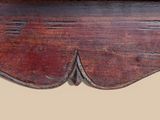 a close up of a wooden table with a drawer underneath it