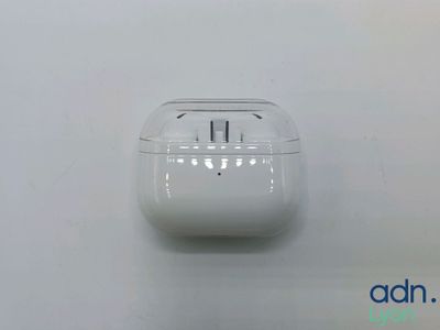 an apple airpods are sitting on top of a white surface