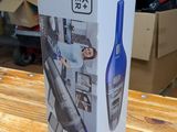 packaging of a black and decker vacuum on a wooden table