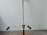 a metal pole with a shovel on top of it