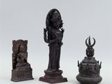 three bronze figurines of hindu deities, including a woman and a man