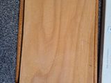 a picture of a wooden box that is open on the floor