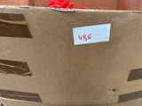 a box with a red pepper in it and a sticker on it