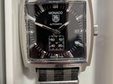 a black and gray watch with a black face