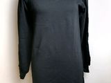 black long sleeved dress on a mannequin mannequin mannequin mannequin mannequin mannequin mannequin mannequin mann