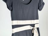 a women ' s t - shirt with a tie around the neck