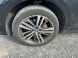 a close up of a tire on a black car
