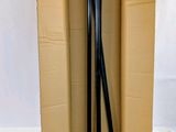 a cardboard box with a pair of skis in it