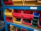 a shelf with many different types of screws and nuts on it