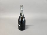 a bottle of wine that is sitting on a table