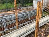 a pile of metal pipes sitting on the ground