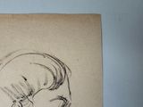 a drawing of a woman ' s face on a piece of paper