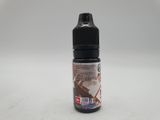 a close up of a bottle of liquid on a white surface