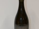 a bottle of wine that is sitting on a table