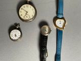 several different types of watches are displayed on a table
