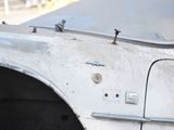 a close up of a car door with a bunch of screws on it