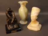 three vases sitting next to each other on a table