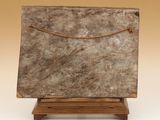 an image of a marble block on a wooden stand