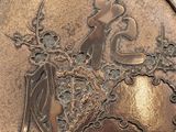 an image of a bronze coin with a woman and a bird on it