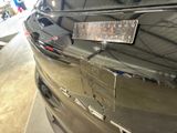 a close up of a car with a license plate on the front of it