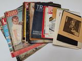 a lot of old magazines sitting on a table
