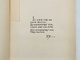 an open book with writing on it on a white surface
