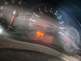 a close up of a speedometer on a car ' s dashboard