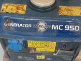 a blue machine that is sitting on top of a wooden pallet