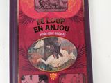 un livre rouge avec des images de personnes et d'animaux dessus