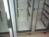 two glass doors that are open in a room