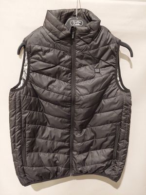 a close up of a vest hanging on a hanger