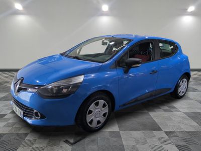 a blue car parked in a garage with a checkered floor