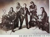 an old photo of a group of bikers posing for a picture
