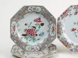 pair of chinese plates with floral designs on them on a white surface