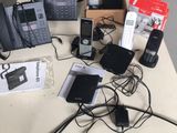 a lot of phones that are sitting on a table