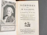 an open book with a picture of a man on it
