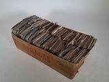 a box full of files sitting on a table