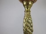 an image of a gold colored lamp hanging from a ceiling